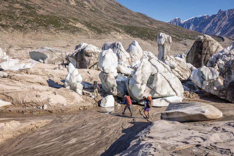 Hikers wearing Patagonia gear exploring rocky mountain terrain